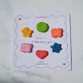 Colorful buttons on a branded card with 'overshrink' branding.