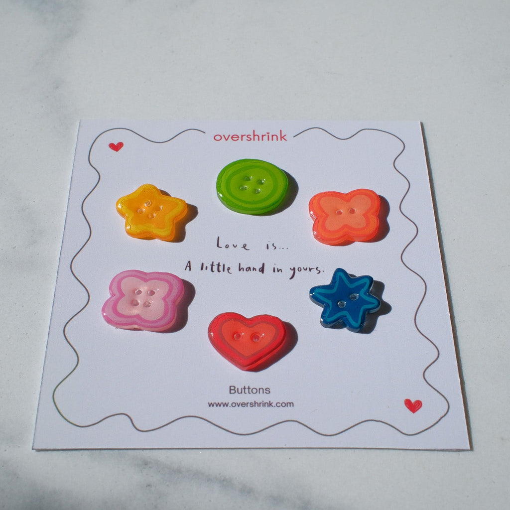 Colorful buttons on a card labeled 'overshrink' with a white background