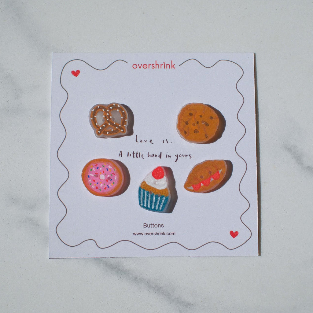 Card with various small buttons on a white background