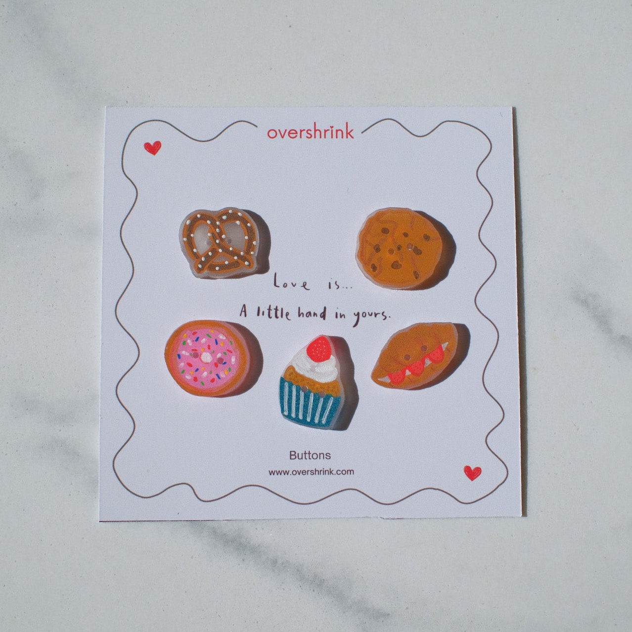 Card with various small buttons on a white background