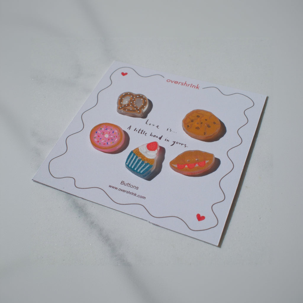 Card with illustrations of cookies and a cupcake on a light gray background